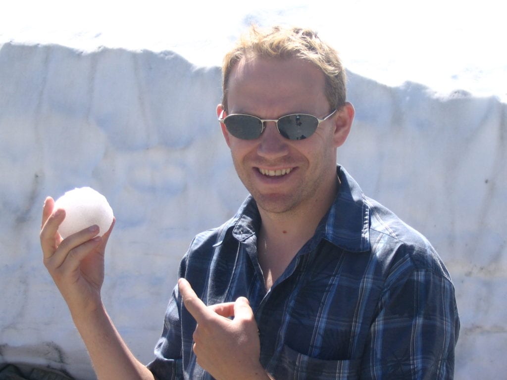 Shawn Power making a snowball on Whistler Mountain in the summer