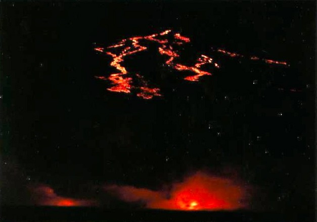 View of lava flow into the Sea at night