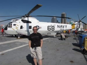 Shawn Power checking out a Navy Helicopter on the USS Midway Aircraft Carrier