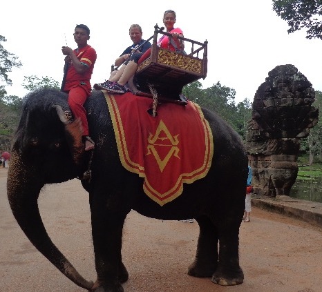 Nancy & Shawn Power riding an Elephant at Angkor Wat in Cambodia