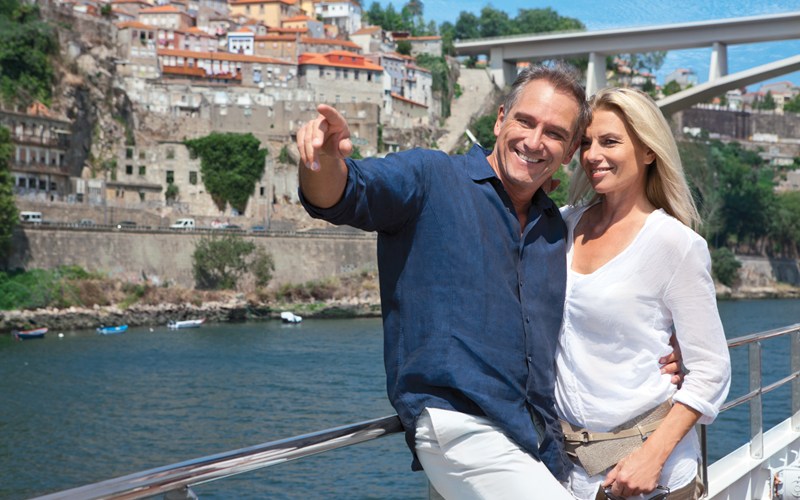 Couple enjoying the views from the Sun Deck on a River Cruise