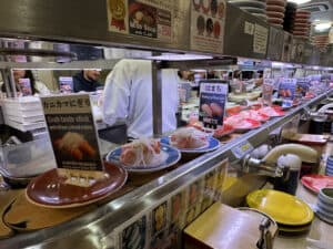 Floating sushi at Musashi Sushi in Kyoto, Japan