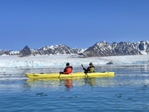 Kayaking near a glacier in the Arctic